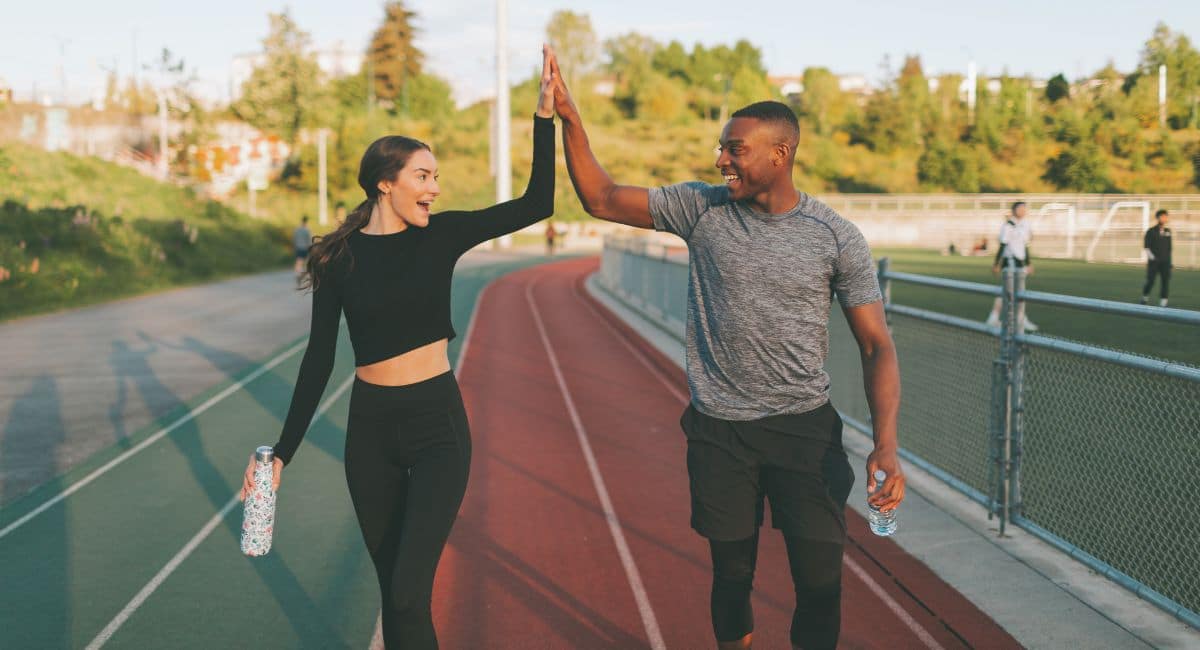 fitness couple giving high five
